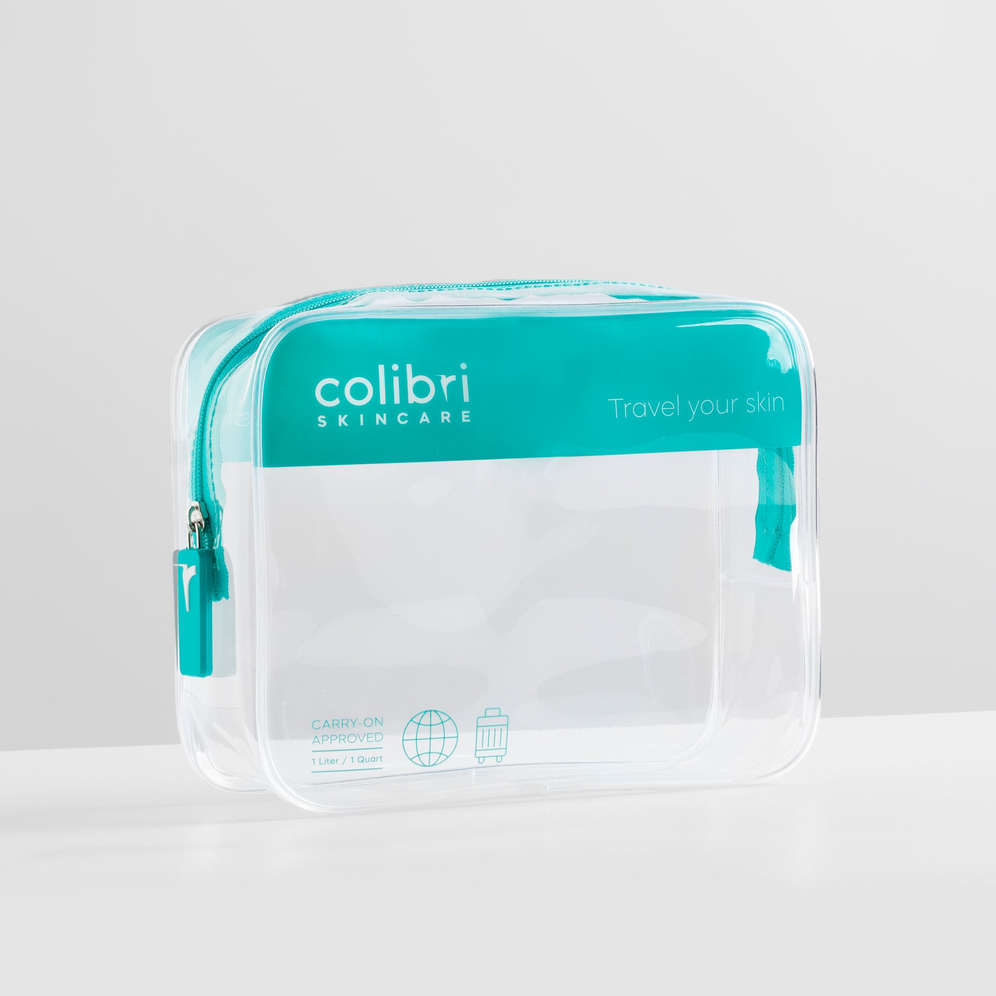 Klarer Kulturbeutel mit türkisfarbenem Reißverschluss und Aufschrift "colibri skincare".